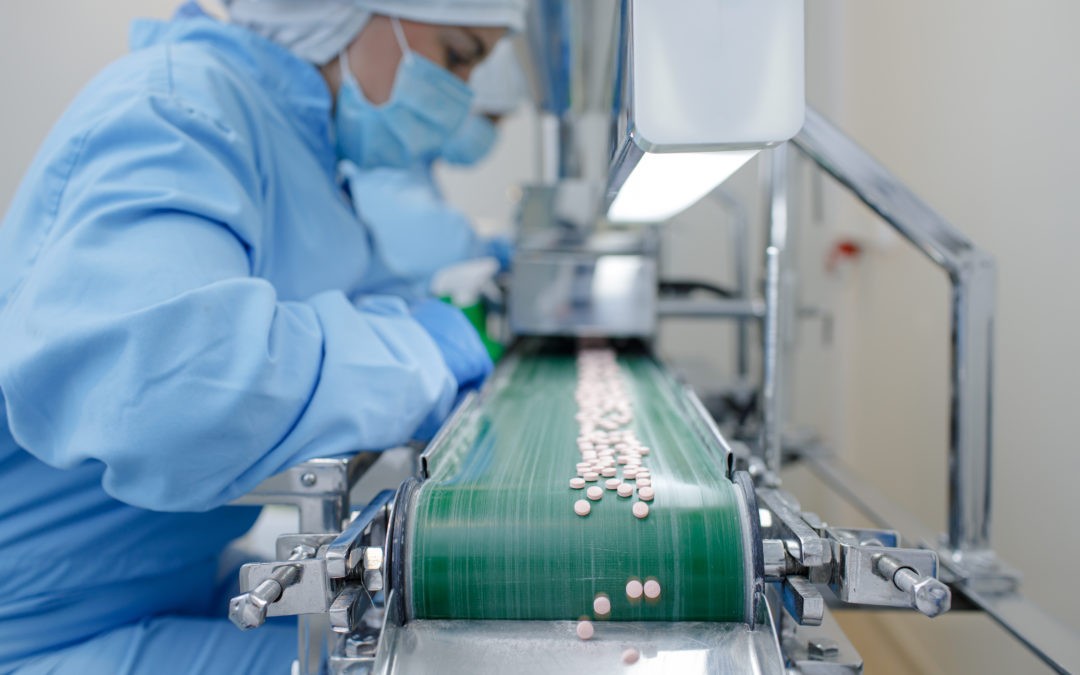 Navigation - Complete Calibration Services Pharmaceutical workers in protective cleanroom suits working in controlled environment